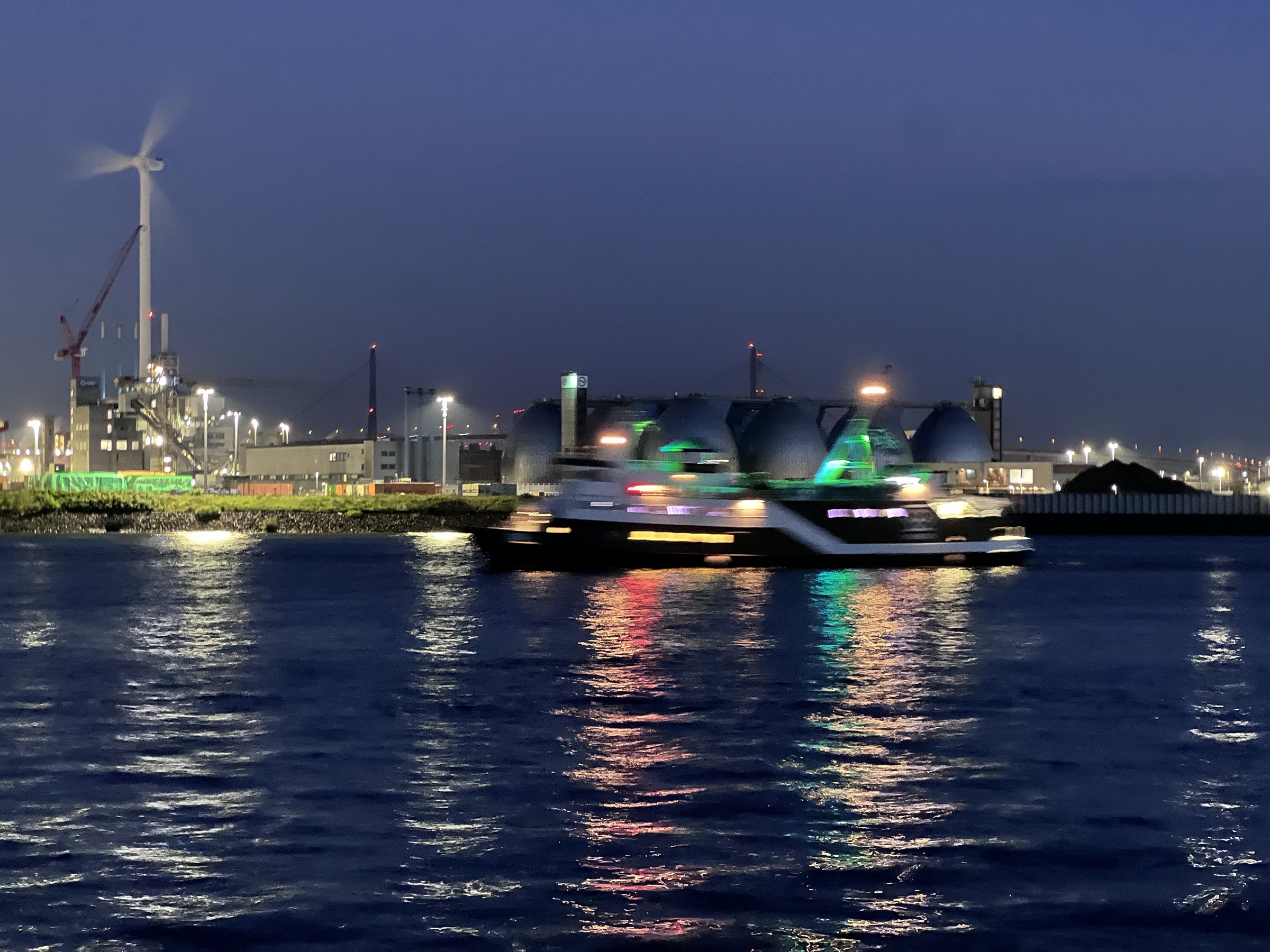 Hamburg harbor ferry with wind turbine