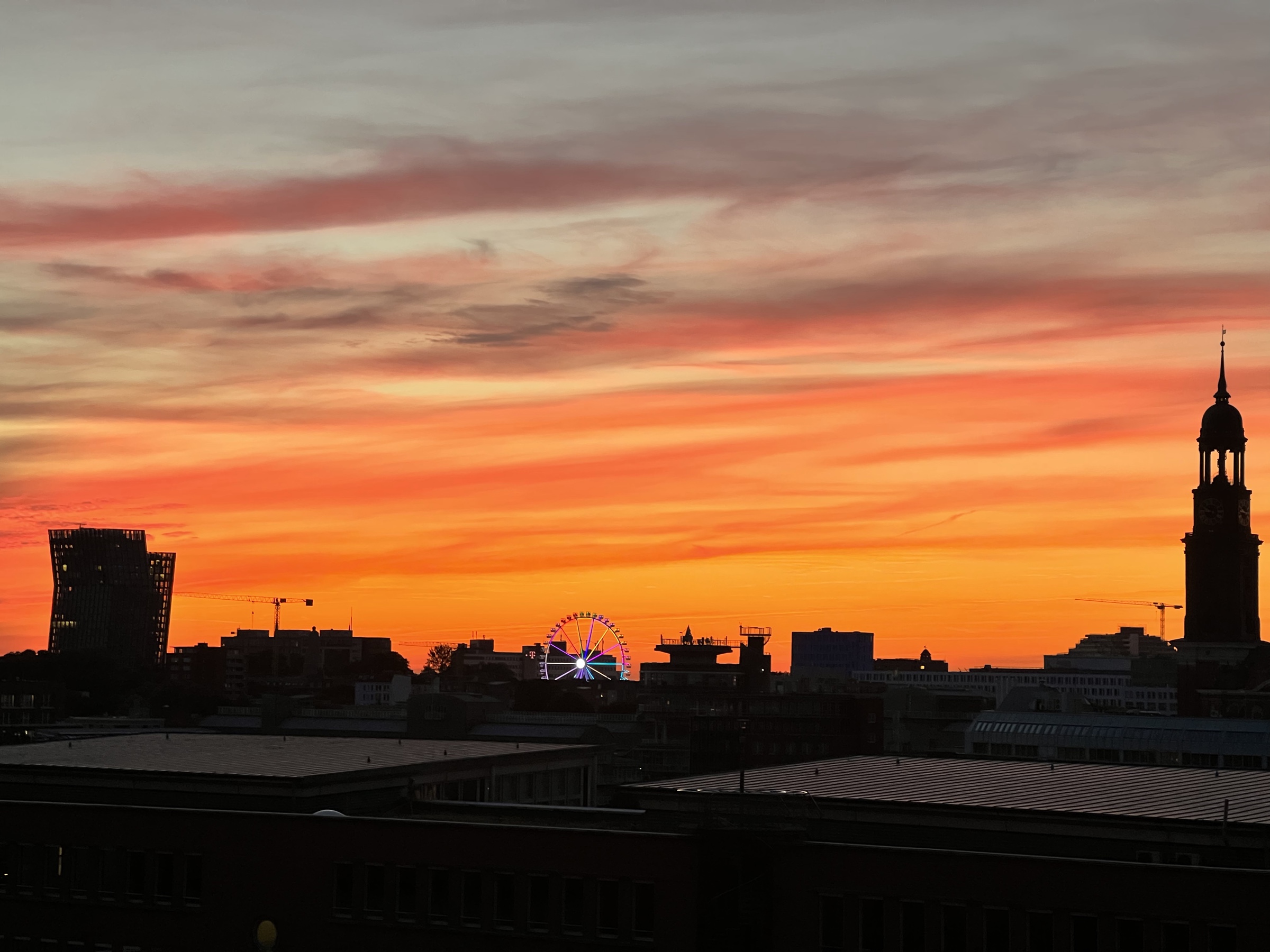 Michel and ferris wheel at sunset