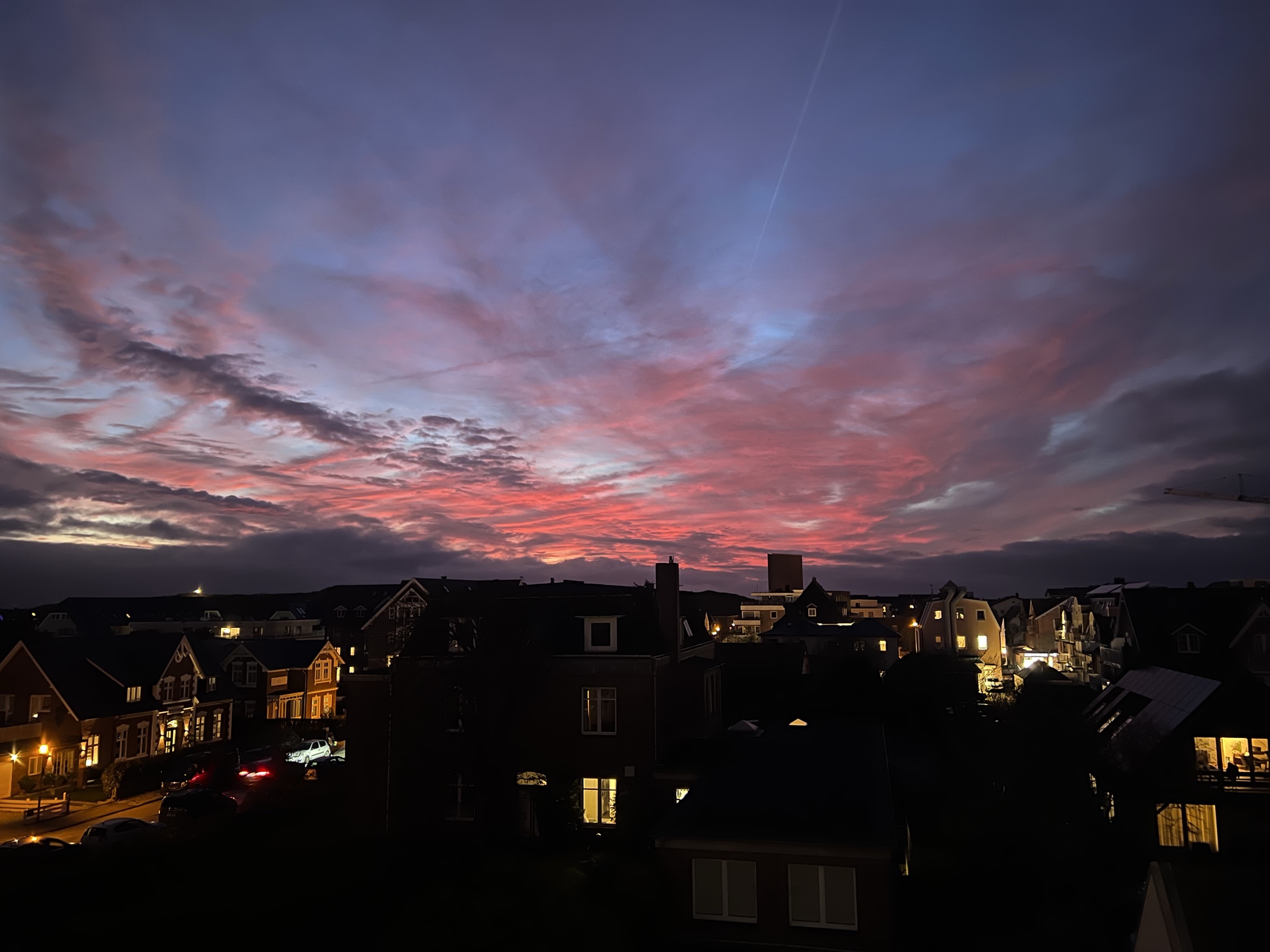 Sylt rooftops at pink sunset